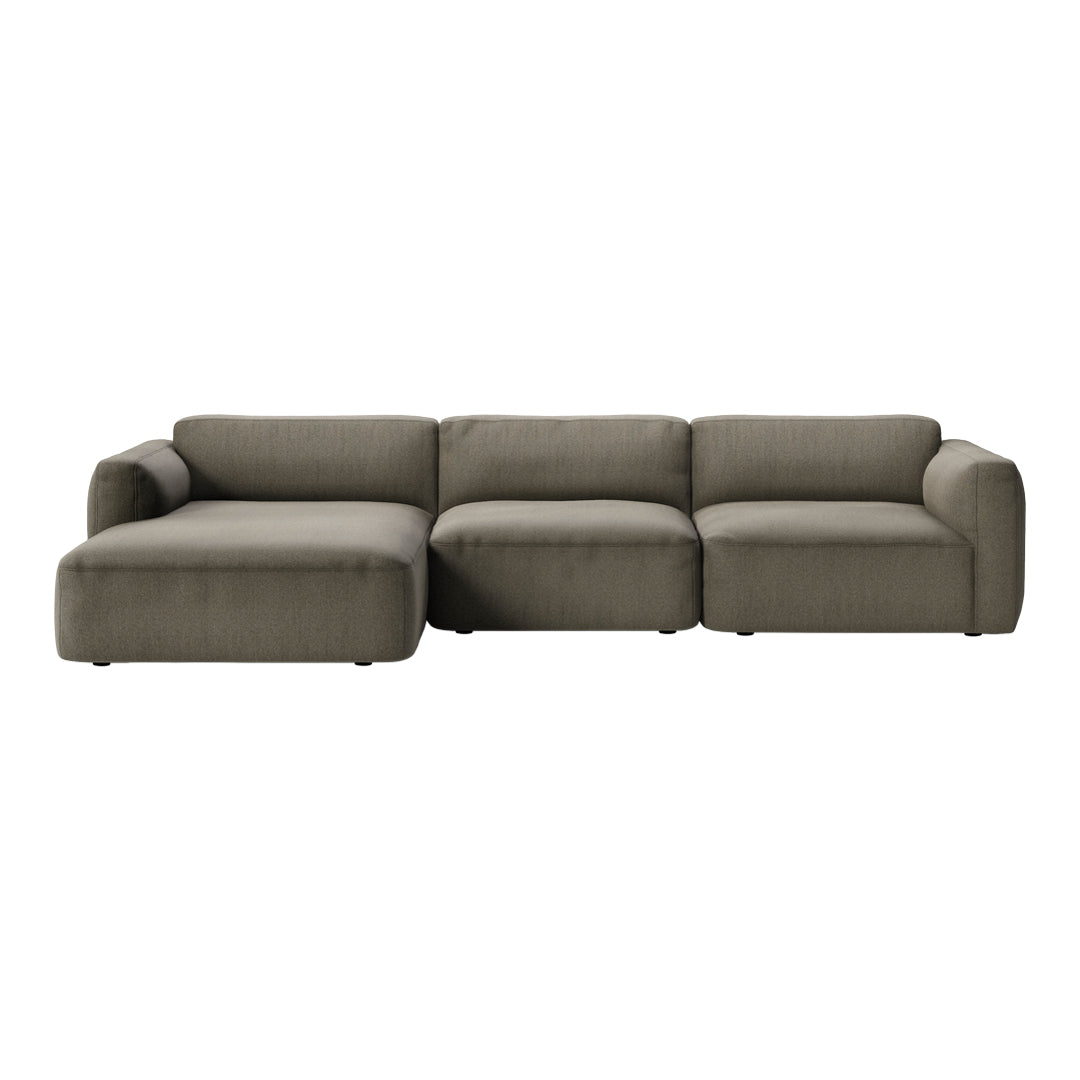 L-shaped sectional sofa in a solid olive green fabric with a soft, textured finish. Modern and cozy design.