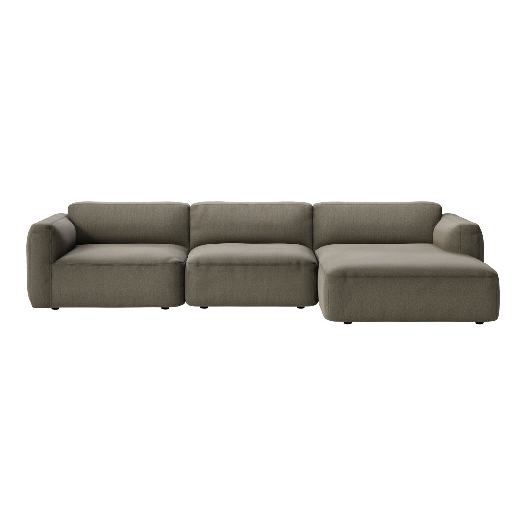 Modern sectional sofa in soft olive green fabric with smooth, contemporary lines and no visible patterns.