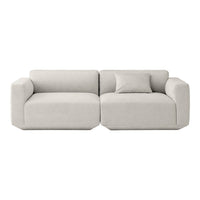 Soft beige modern sofa with smooth fabric and minimalistic design, featuring clean lines and a simple silhouette.