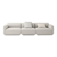 Modern sectional sofa in soft beige with a smooth texture and subtle cushion accents. Perfect for any living space.