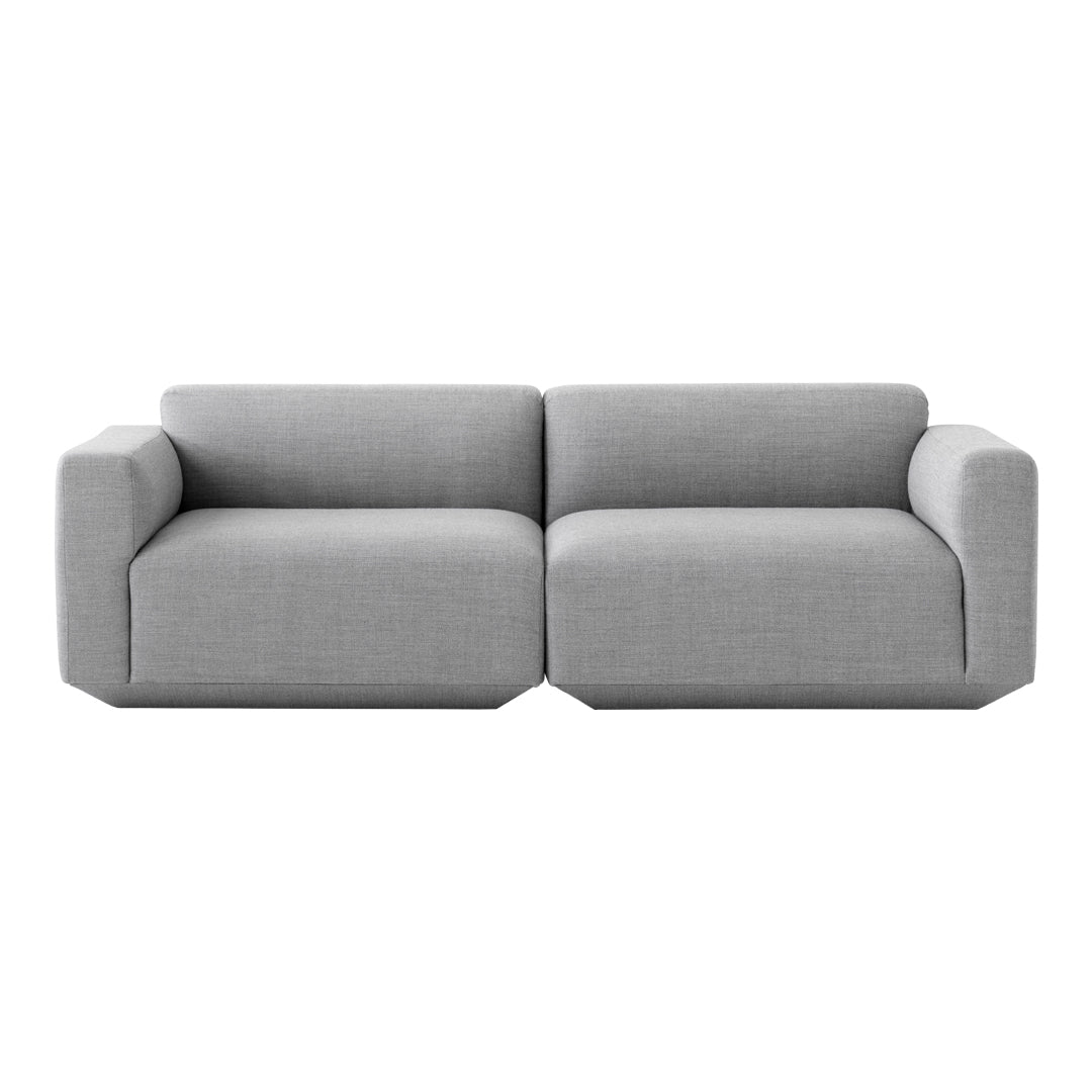 Gray modern sectional sofa with a minimalist design and smooth fabric finish. Perfect for contemporary living spaces.
