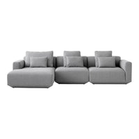 Modern gray sectional sofa with smooth fabric, featuring clean lines and multiple plush cushions for added comfort.