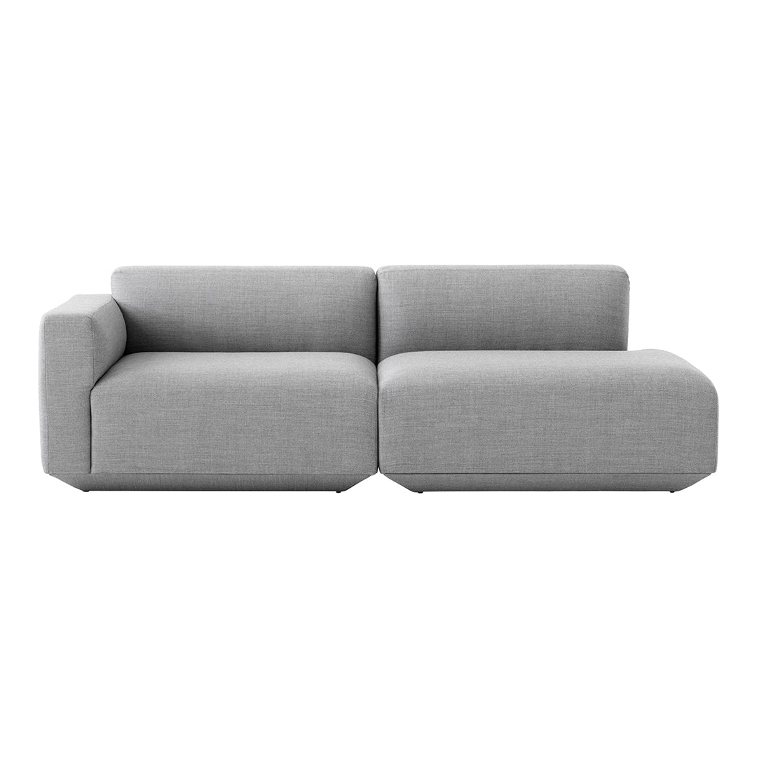 Modern two-toned grey sectional sofa with a sleek, minimalist design and textured fabric.