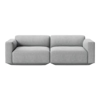 Light gray modular sofa with a minimalist design and smooth, textured fabric. Perfect for modern interiors.