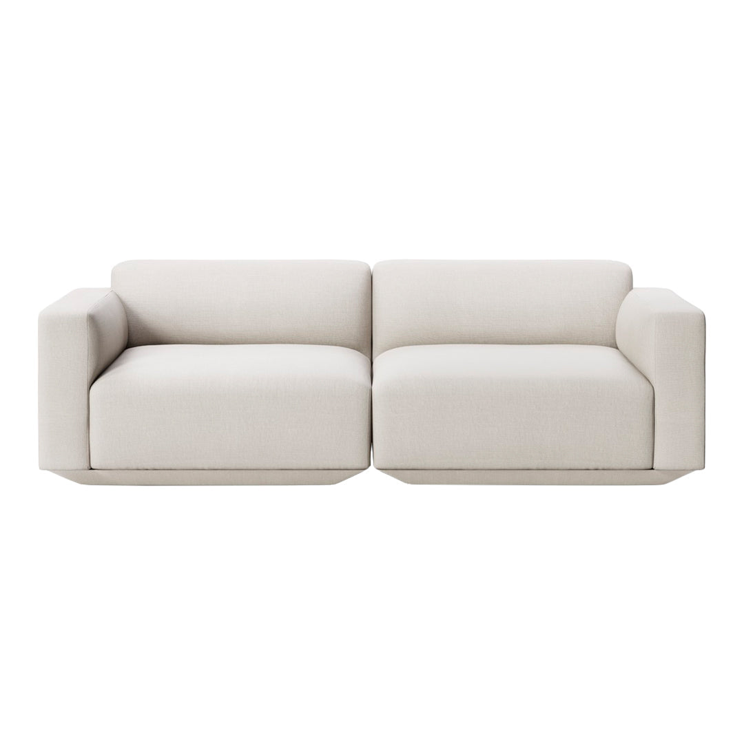 Light beige, minimalist two-seater sofa with smooth fabric and clean lines, perfect for modern decor.