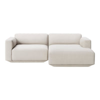 Light beige sectional sofa with a smooth, textured fabric and minimalistic, modern design. No visible patterns.