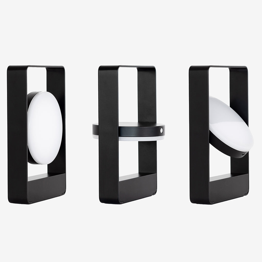 Modern black and white geometric lamps showcasing smooth shapes and contrasting patterns. Ideal for contemporary decor.
