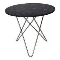 Round black marble table with subtle white veining and sleek silver metal tripod base. Modern design for any decor.