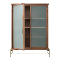 Wooden cabinet with frosted glass doors and a sleek metal base, featuring neutral tones and minimalist design.