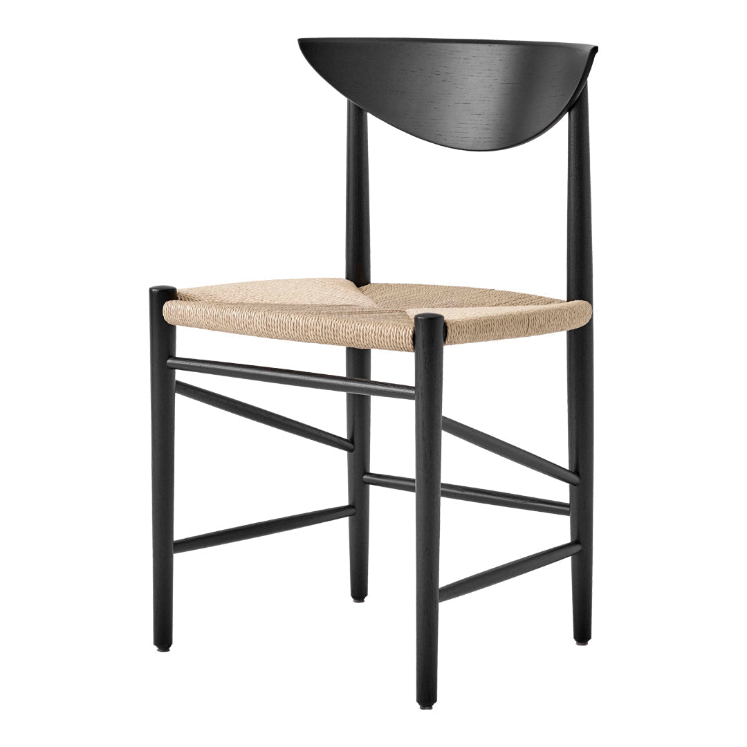 Black chair with a curved back and woven beige seat, featuring a minimalist design and clean lines.