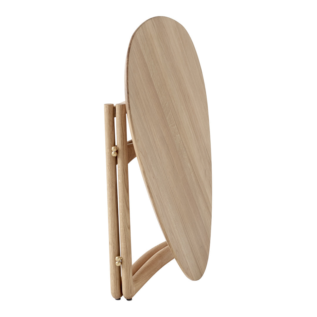 Light wood folding table with a smooth, oval surface and natural grain pattern. Perfect for modern decor.