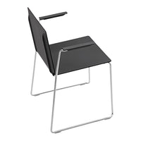Modern black chair with minimalist design, featuring a sleek chrome frame and smooth, solid seat.