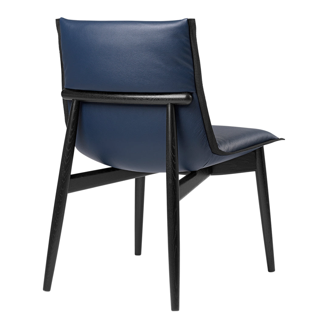 Navy blue upholstered chair with sleek black wooden legs and simple, modern design.
