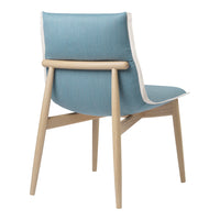 Light blue fabric chair with a natural wood frame and white trim, showcasing a modern, minimalist design.