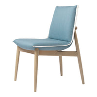 Light blue chair with a white trim and natural wood legs, featuring a sleek, minimalist design.