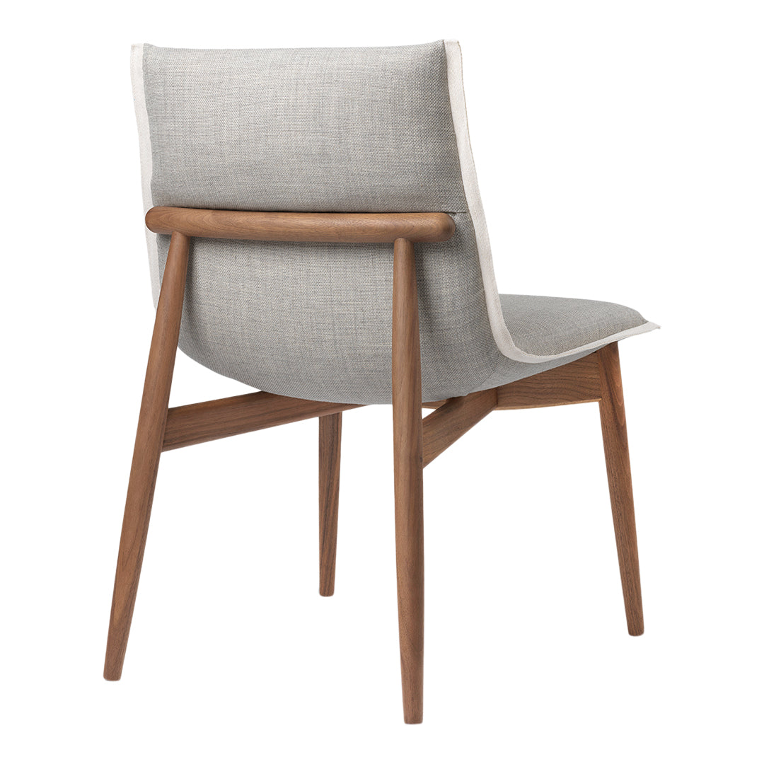 Gray upholstered chair with contrasting white trim and natural wood legs. Modern design with clean lines.