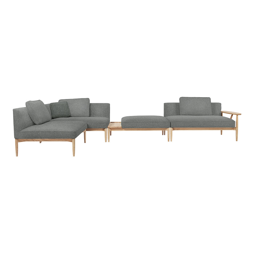 Modern gray sectional sofa with clean lines and a minimalist design, complemented by light wooden legs.