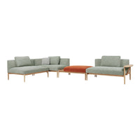 Lush green fabric sectional sofa with modern design, featuring a rust-colored ottoman for a stylish contrast.