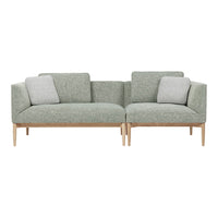 Green textured fabric sofa with light gray cushions and wooden legs, featuring a modern, minimalist design.
