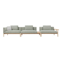 Light green upholstered sofa with a minimalist design and wooden accents, featuring simple, modern patterns.