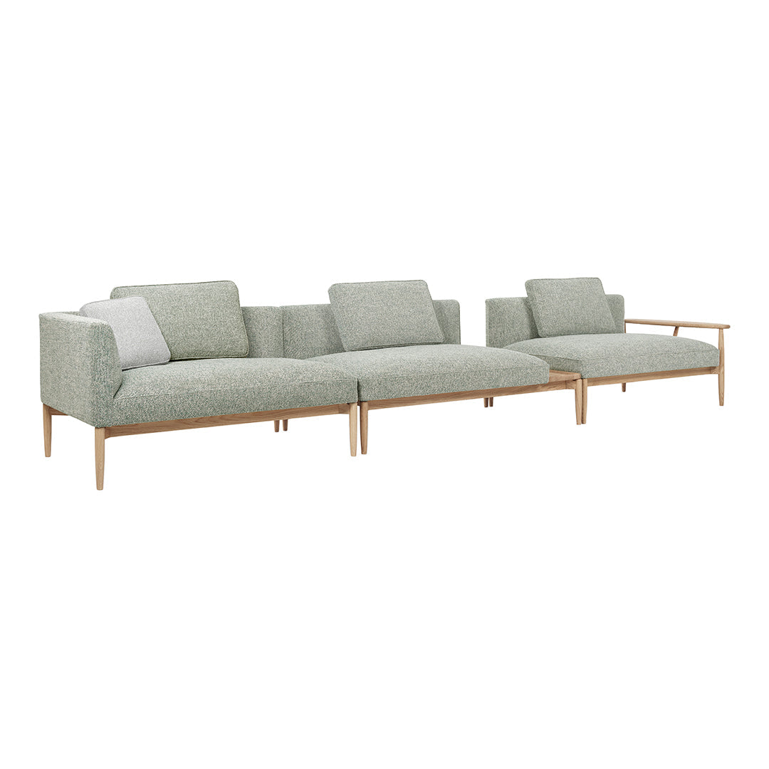 Light green textured fabric sofa with wooden legs, featuring a modern, minimalistic design.