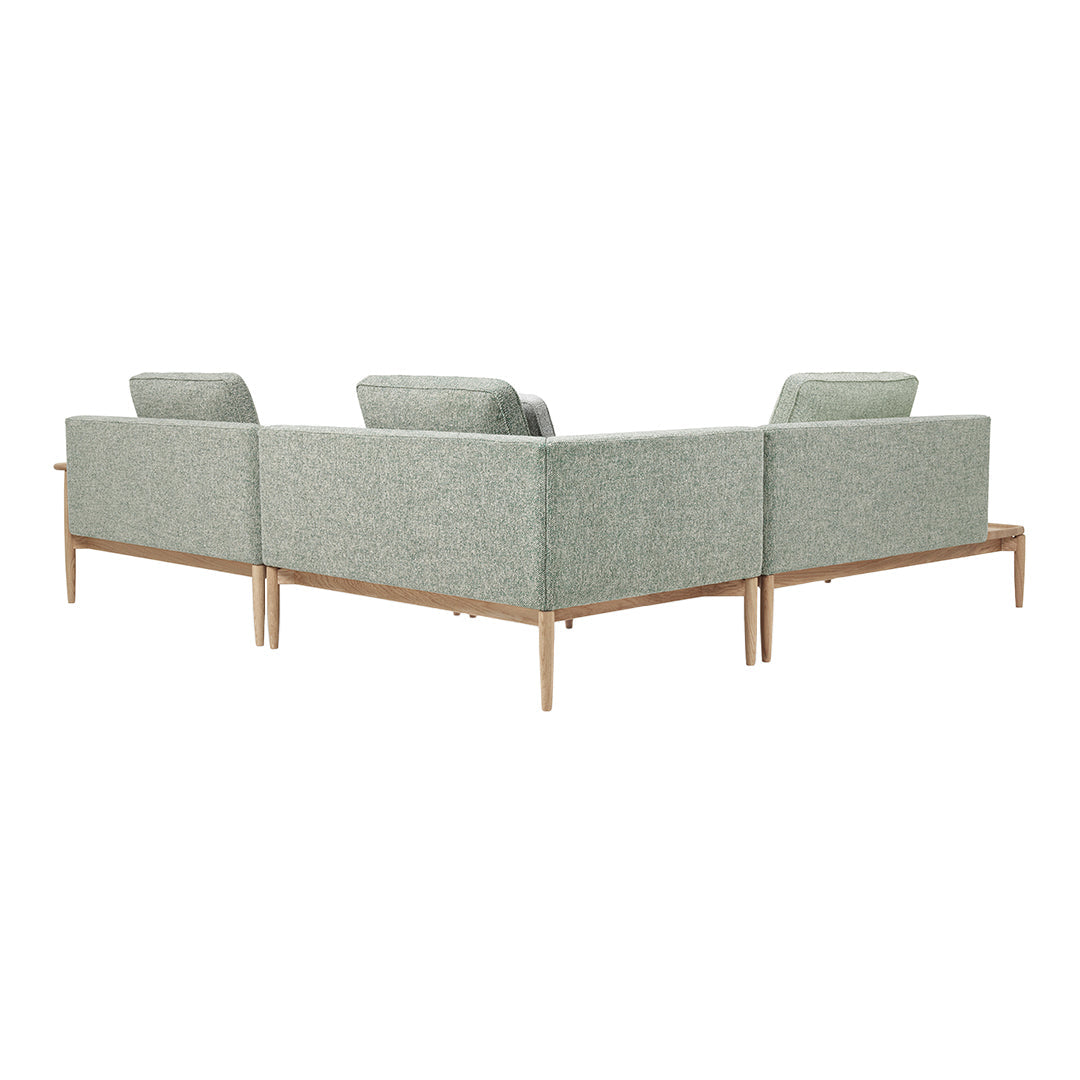 Stylish green textured upholstery sofa with light wooden legs, ideal for modern living spaces.