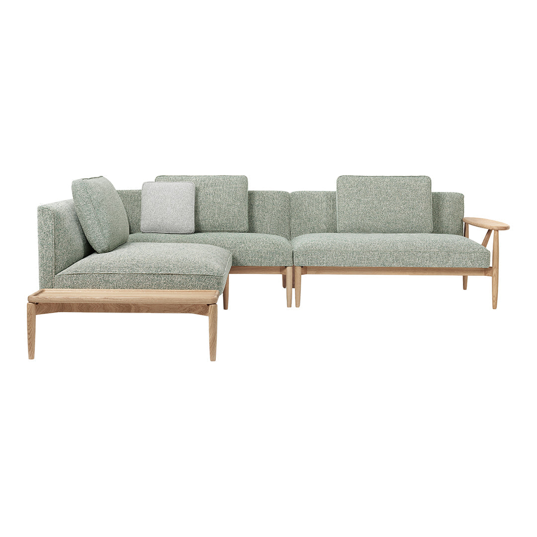 Light grey sectional sofa with a textured pattern and wooden legs, perfect for modern living spaces.