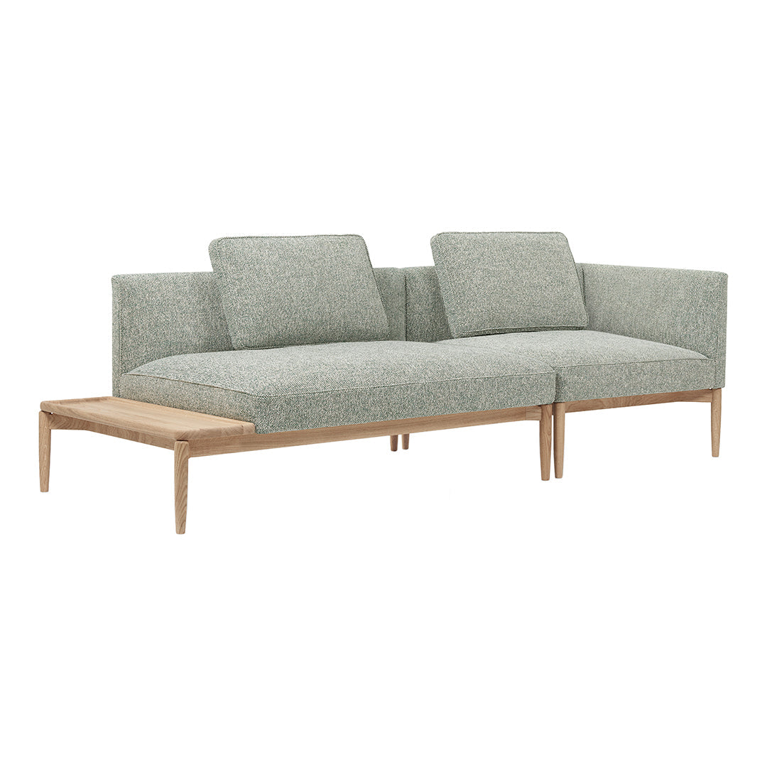Light gray textured fabric sectional sofa with modern wood legs and clean, minimalist design.