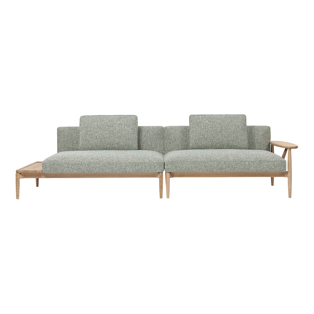 Light green textured upholstery sofa with natural wooden legs and minimalistic design. Ideal for modern living spaces.