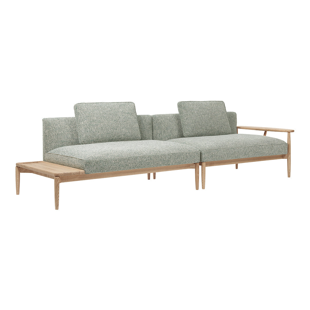 Green patterned fabric sofa with light wooden frame, featuring clean lines and modern design. Perfect for contemporary spaces.