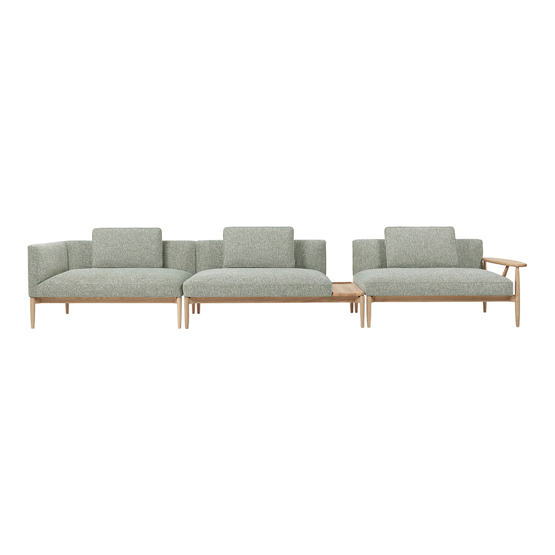 Modern three-piece sofa set in soft gray upholstery with a subtle textured pattern and light wood accents.