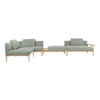 Modern sectional sofa in soft sage green with a clean, minimalistic design and light wood accents.