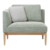 Light green textured upholstery with a gray accent pillow and natural wood legs, perfect for stylish living spaces.