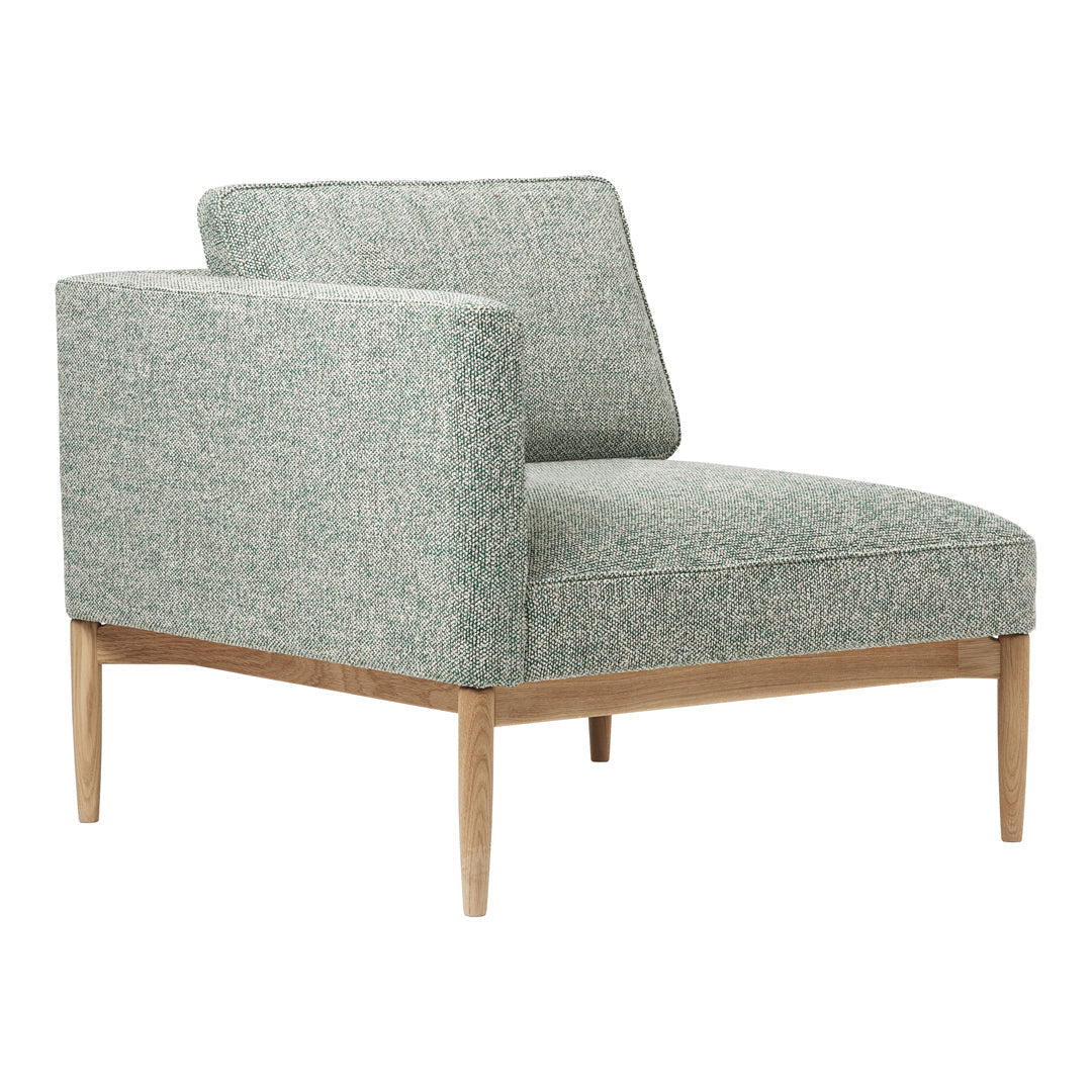 Light green upholstered chair with a textured pattern and natural wood legs. Ideal for modern decor enhancement.