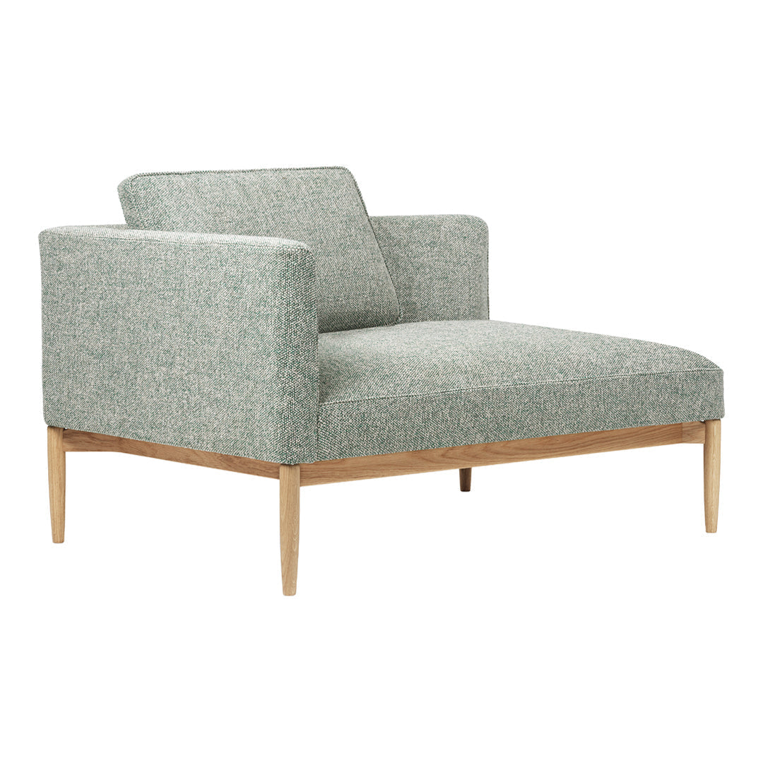 Light gray upholstery with subtle texture and wooden legs, offering a modern and minimalist aesthetic.