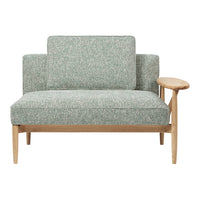 Mint green textured fabric loveseat with light wood armrest and clean lines, perfect for modern decor.