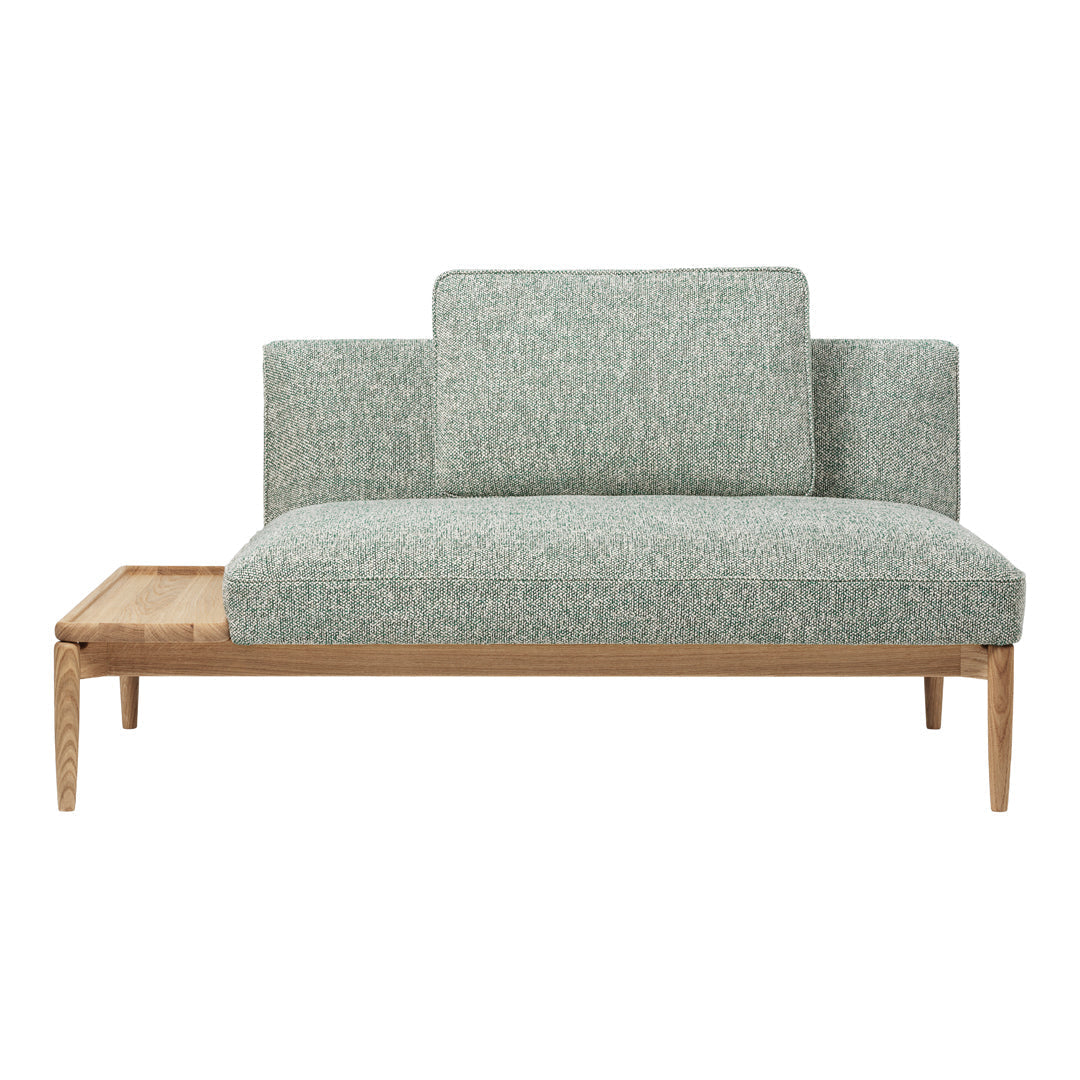 Light teal upholstered sofa with a textured pattern and natural wood base. Modern design with clean lines.