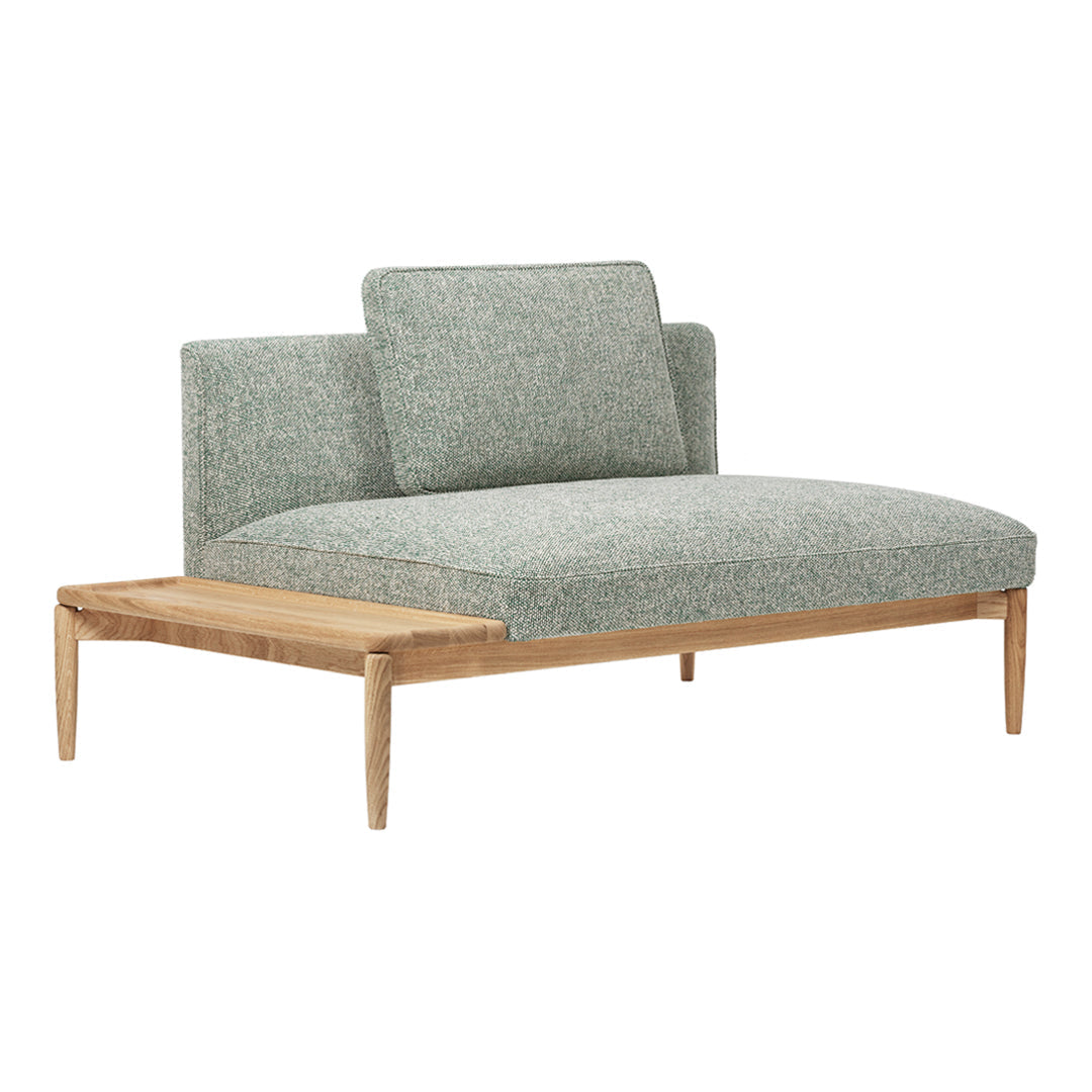 Light green textured upholstery with a natural wood frame, modern design, and minimalist aesthetic.