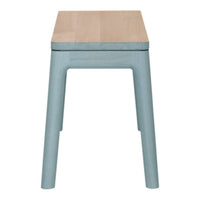 Light wood tabletop with soft blue legs, featuring a minimalist design and smooth finish for a modern look.