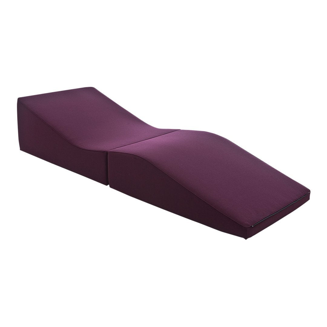 Purple lounge chair with a sleek, modern design and smooth fabric finish, ideal for stylish interiors.