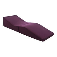 Purple lounge chair with a sleek, modern design and smooth fabric finish, ideal for stylish interiors.