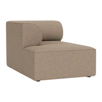 Modern beige chaise lounge with a textured fabric and minimalist design, perfect for contemporary decor.