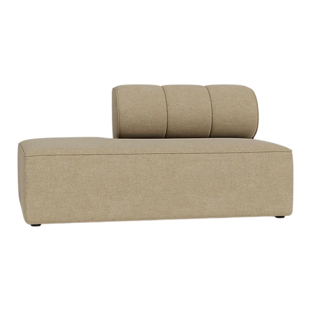 Beige chaise lounge with a textured, minimalistic design and three cylindrical cushions on the back.