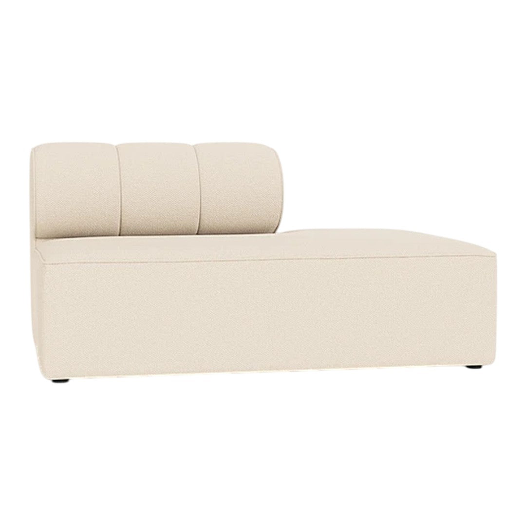 Cream-colored chaise lounge with smooth, minimalist design and three vertical backrest cushions.