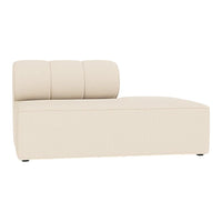 Cream-colored chaise lounge with smooth, minimalist design and three vertical backrest cushions.
