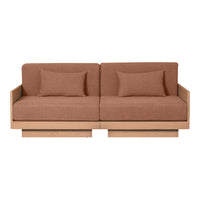Brown upholstered sofa with a minimalist design and wooden base, featuring solid color cushions for a contemporary look.