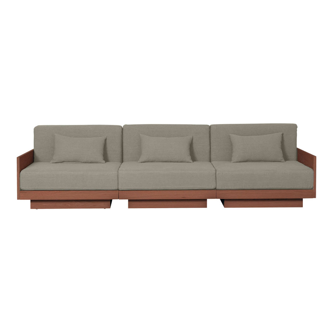Modern three-seater sofa in warm brown wood with soft, light gray fabric cushions and sleek, minimalist design.