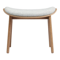 Gray upholstered stool with a curved seat and natural wooden legs. Simple, modern design complements various decor styles.