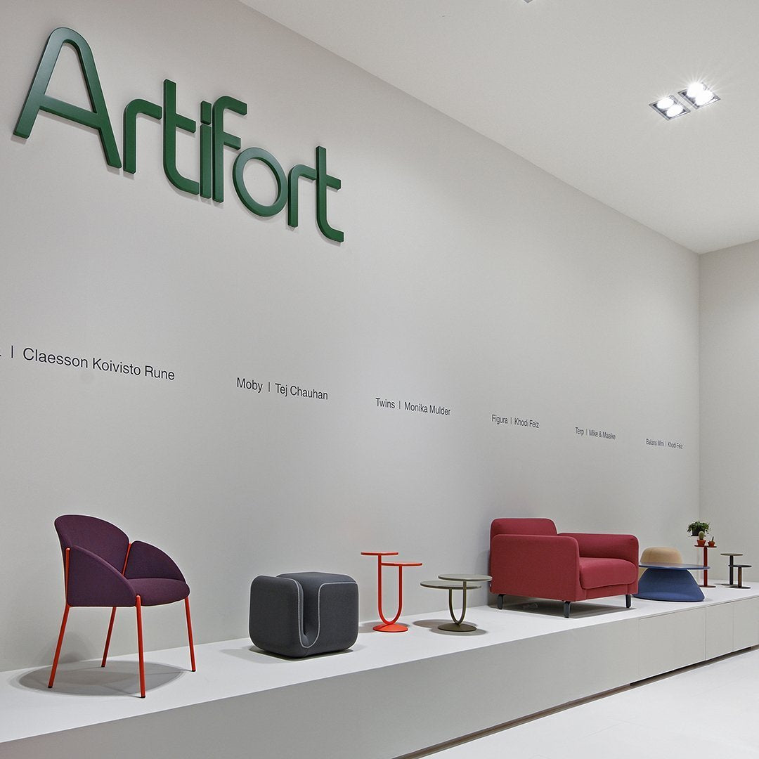 "Colorful modern furniture display featuring deep purple, vibrant red, and neutral gray accents on a minimalist backdrop."