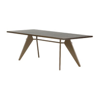 Modern rectangular table with a wood finish and contrasting triangular legs in neutral beige tones. Perfect for contemporary spaces.